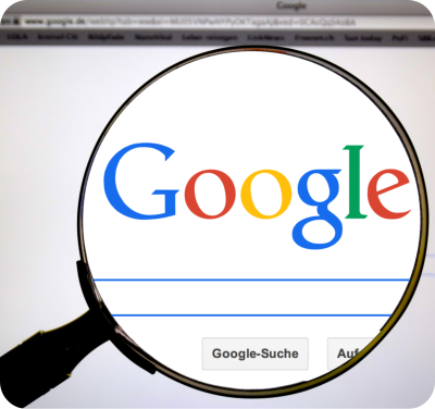 Google search page with magnify glass over the top
